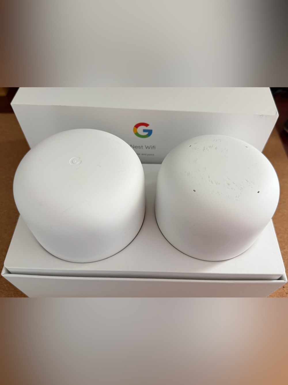 google white mesh Wi‑Fi router and satellite duo
